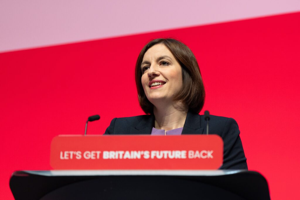 Bridget Phillipson MP gives a speech from a podium that reads 