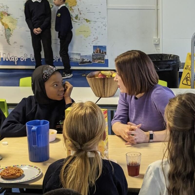 Bridget Phillipson talks to children at Thorney Close Primary breakfast club.