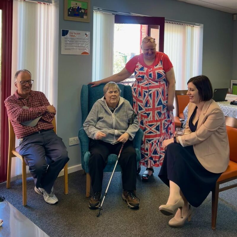 Bridget (right) with volunteer, Beth, and attendees at cake & chat. 