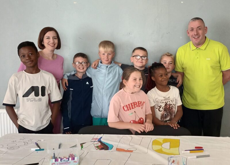 Bridget (right) with Councillor Phil Tye and children at the Youth Almighty Project 